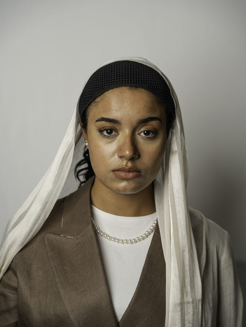Ikleel Crown worn with white scarf
